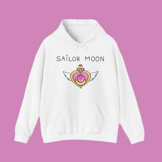 White hoodie with a front pocket, featuring a text on the chest 'SAILOR MOON'. Below the text is an illustration of Sailor Moon's signature heart item in yellow and pink.
