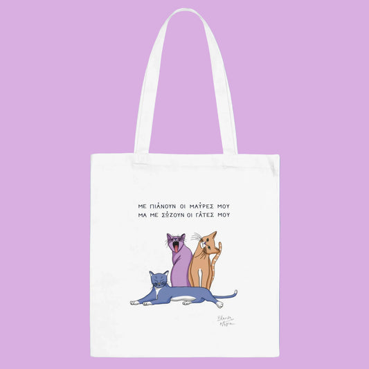 White tote bag with cartoon cats and text on a white background