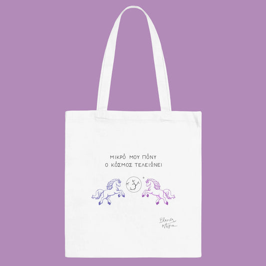 White tote bag with unicorn design and text on a white background